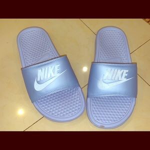Purple Nike slides
